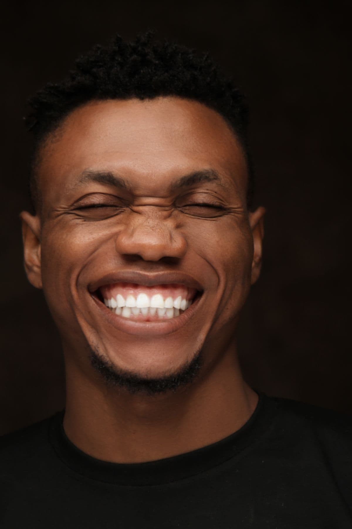 A man with a strong, natural, bright smile