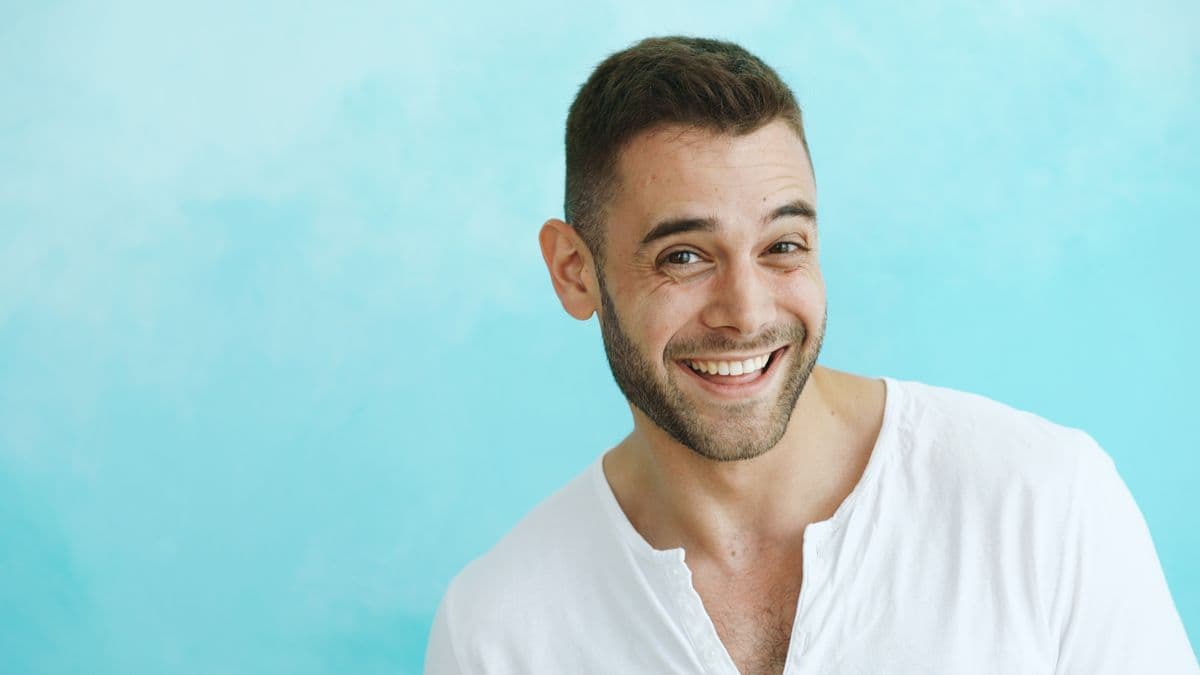 A man with a bright, white smile